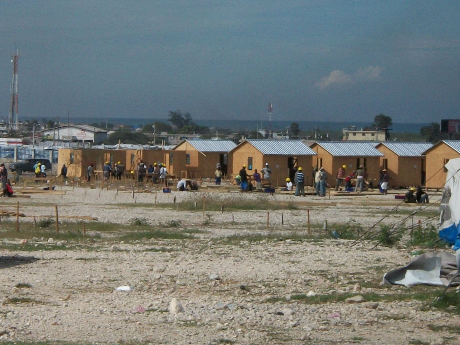Workers constructing houses for deaf communities in Haiti