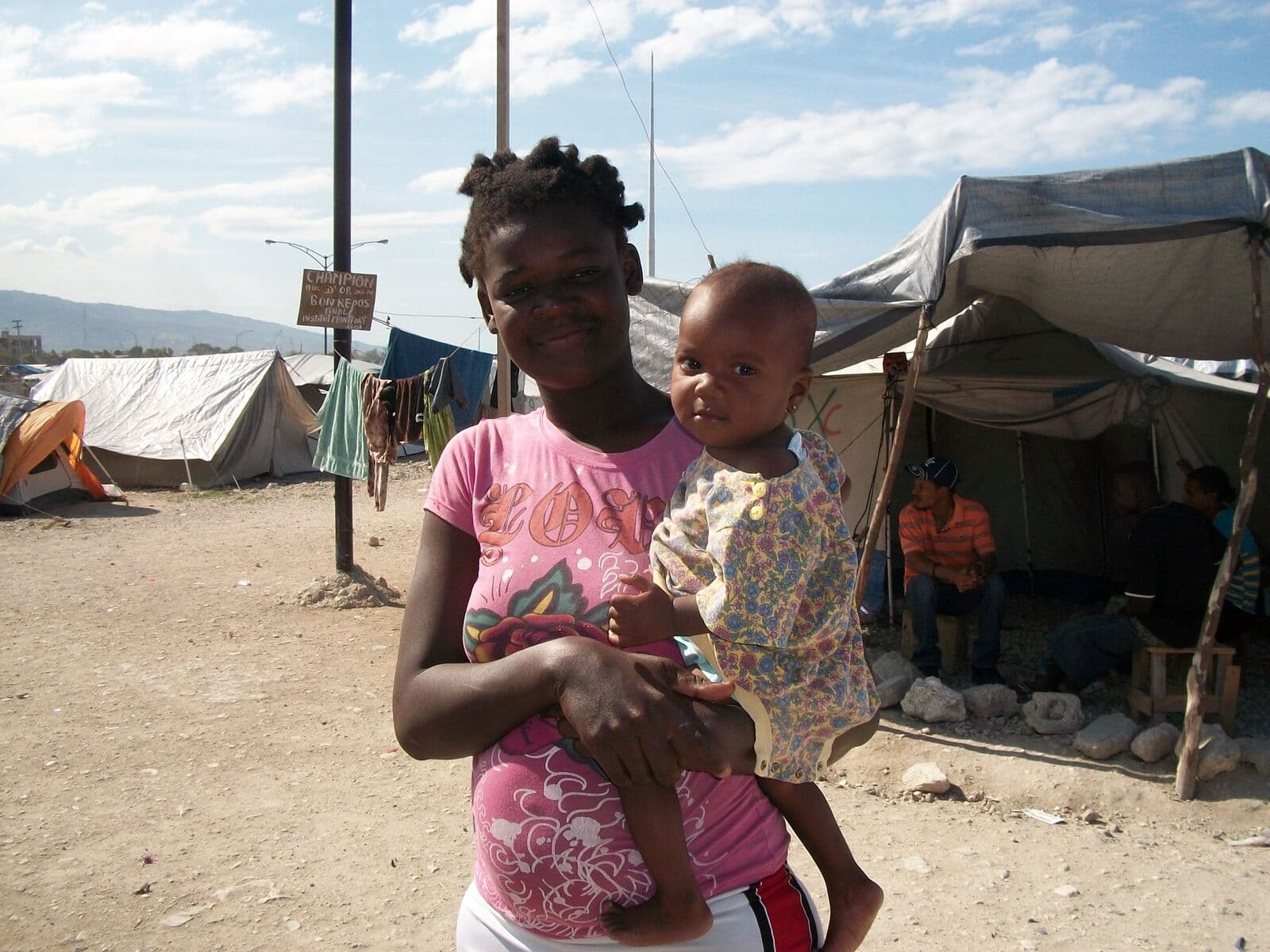 Deaf mother and child at an emergency camp in Haiti
